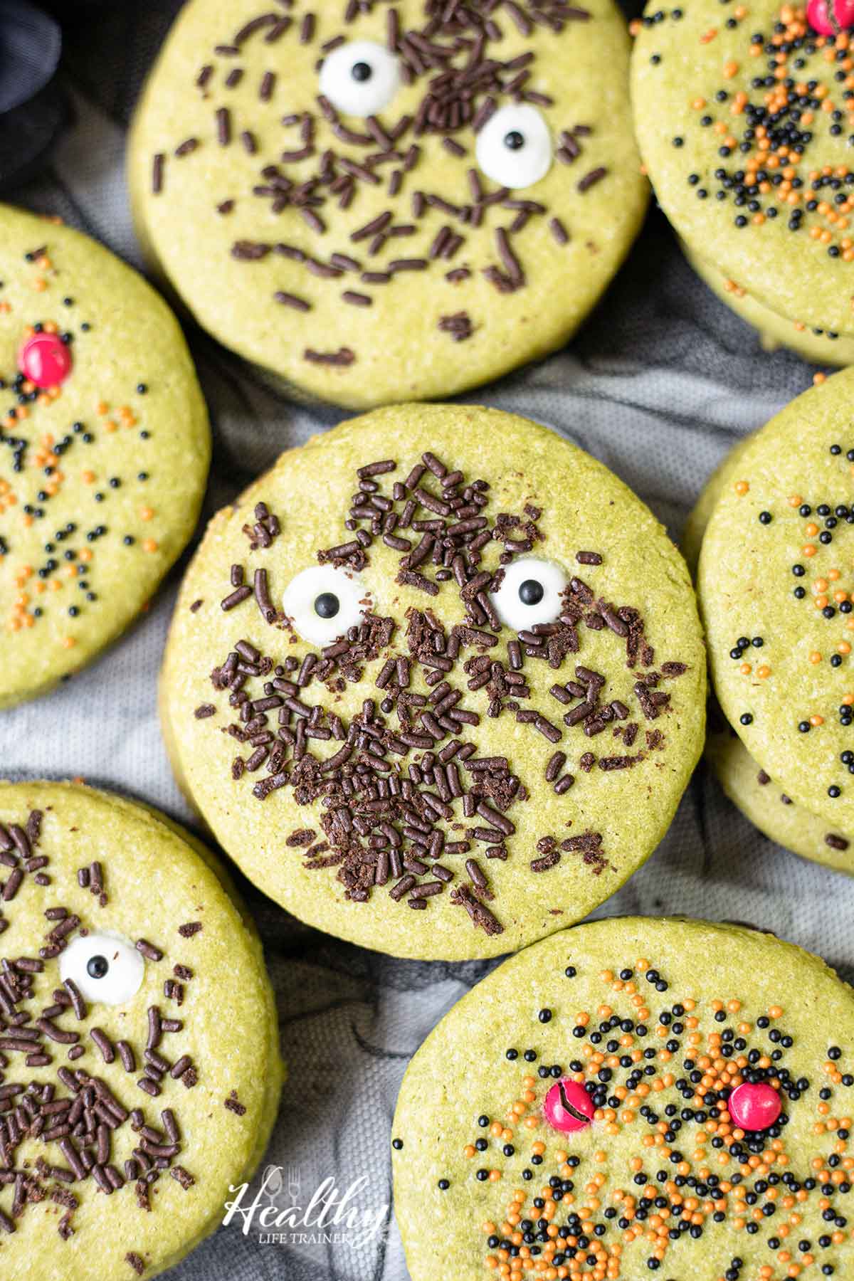 easy decorated halloween cookies with Halloween sprinkles and candy eyes.