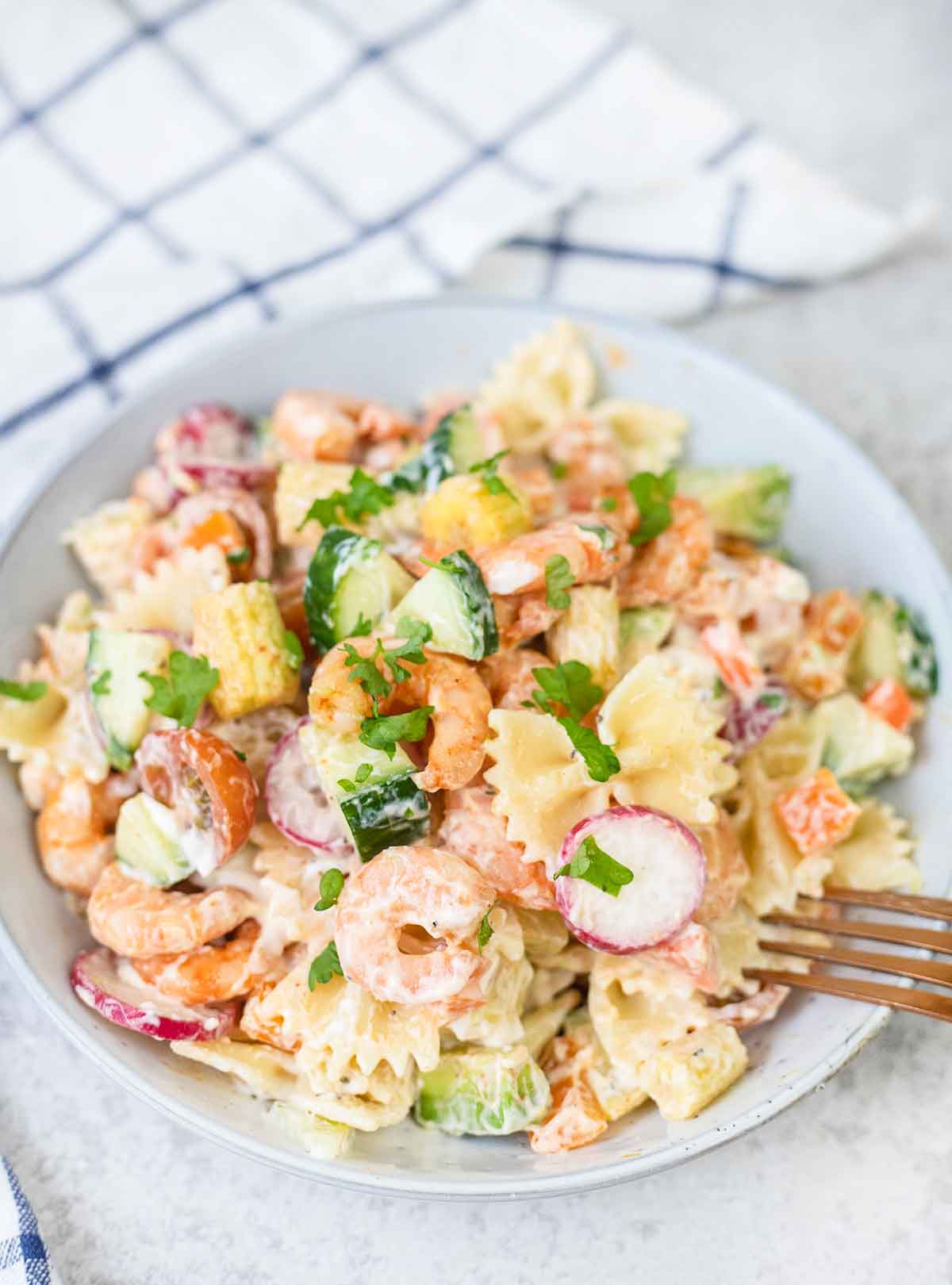 Italian shrimp pasta salad mixed with a homemade creamy dressing.