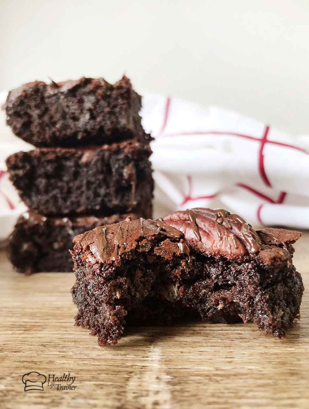 A bite from the low-carb zucchini brownie shows how fudgy it is.