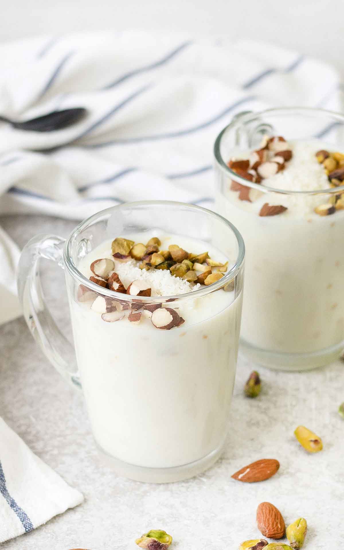 Mediterranean milk pudding in a cup topped with nuts.
