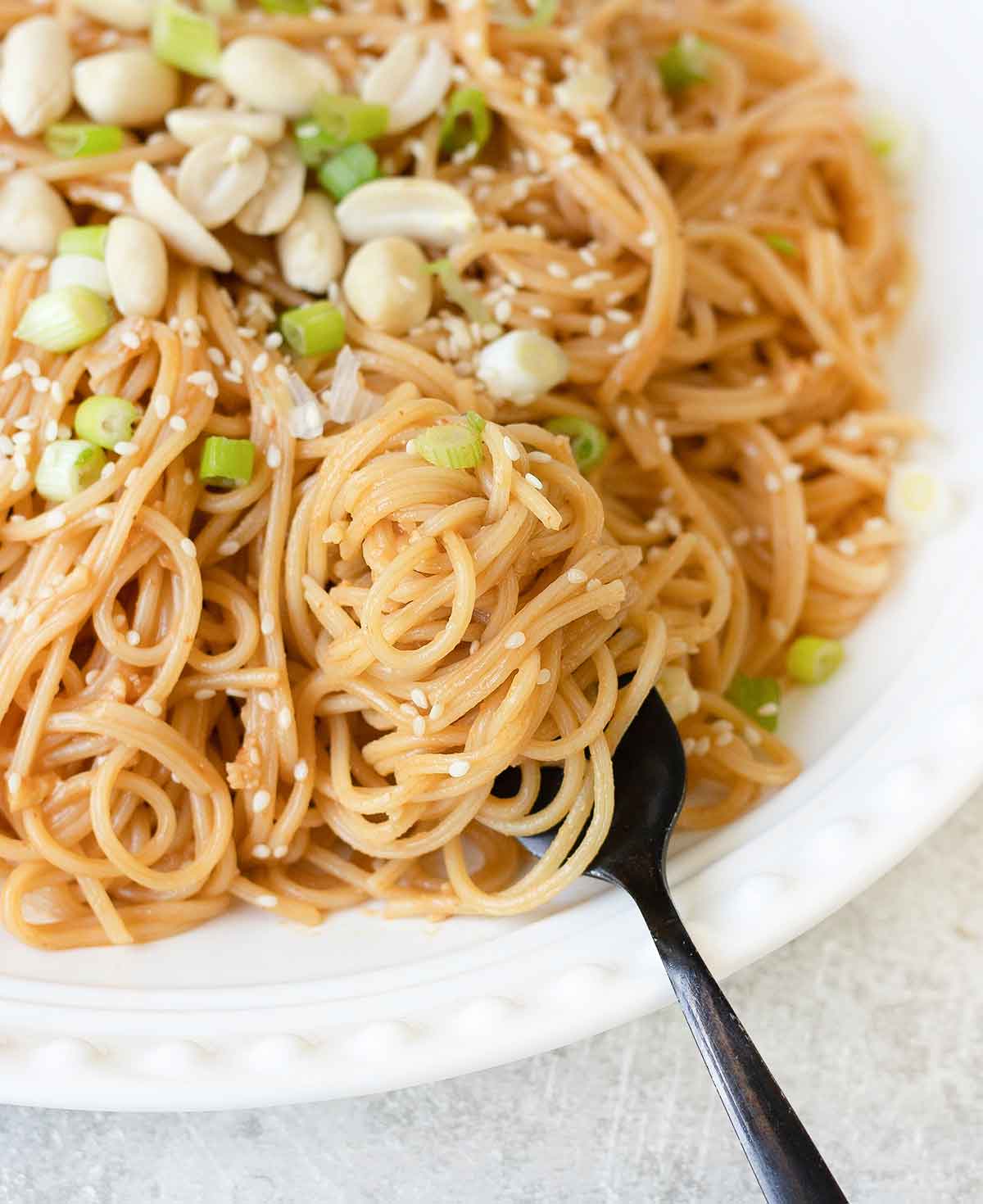 a fork full of sesame peanut noodles.