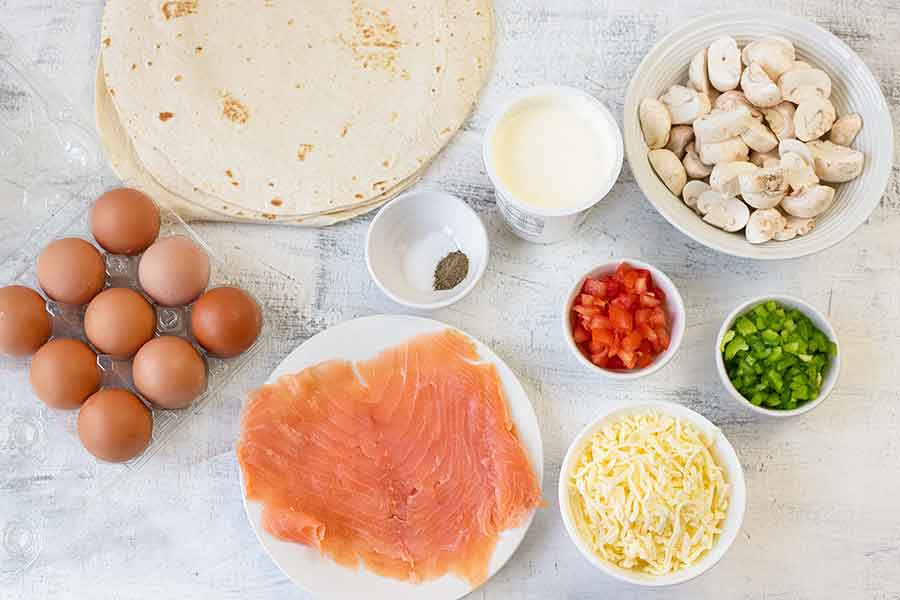 All the ingredients needed for making the toasted breakfast burritos recipe.