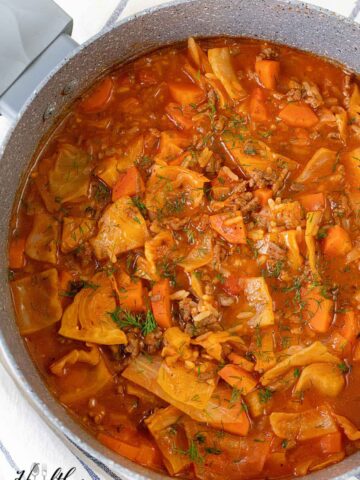 A large pot filled with cabbage roll soup.