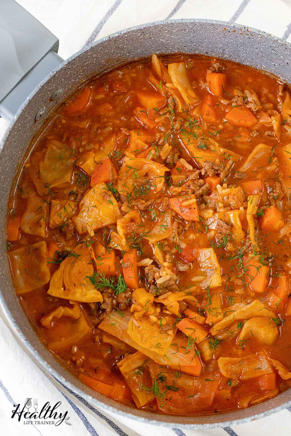 A large pot filled with cabbage roll soup.