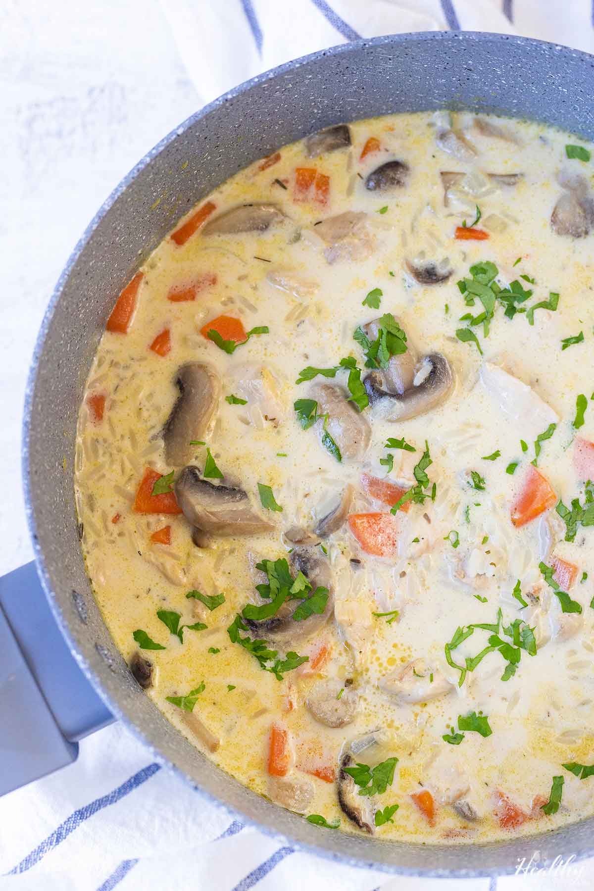 a pot full of easy creamy chicken and rice soup.