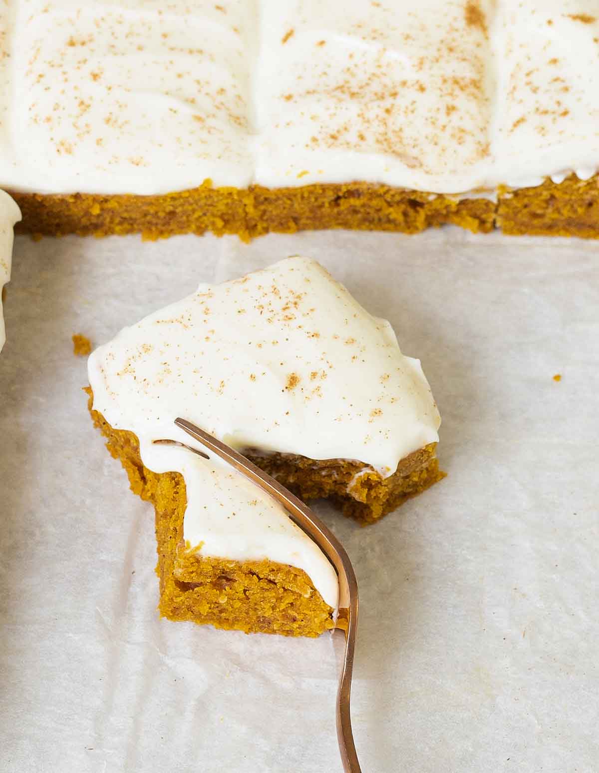Eating a slice of the Pumpkin Squares with a fork.