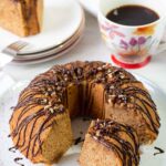 Cut the sweet potato pound cake topped with pecan and chocolate glaze into slices.