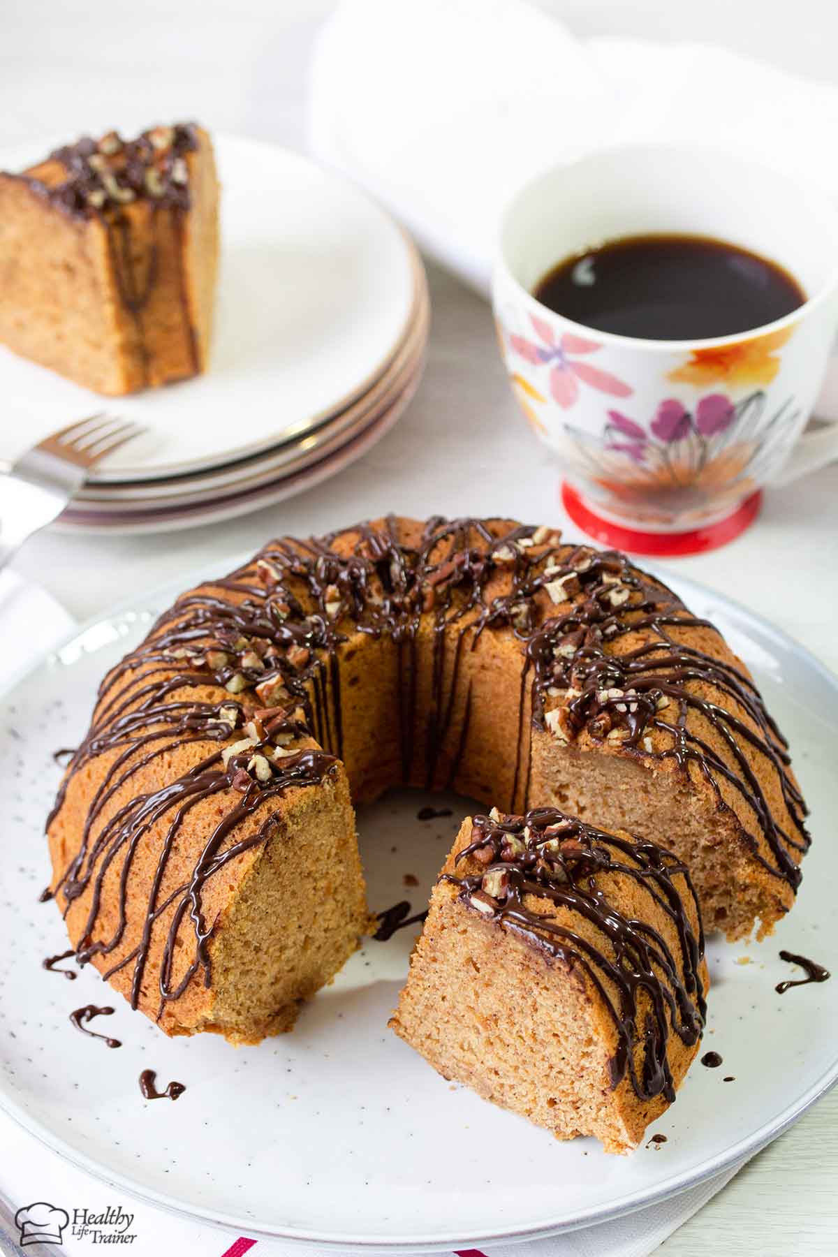 Cut the sweet potato pound cake topped with pecan and chocolate glaze into slices.