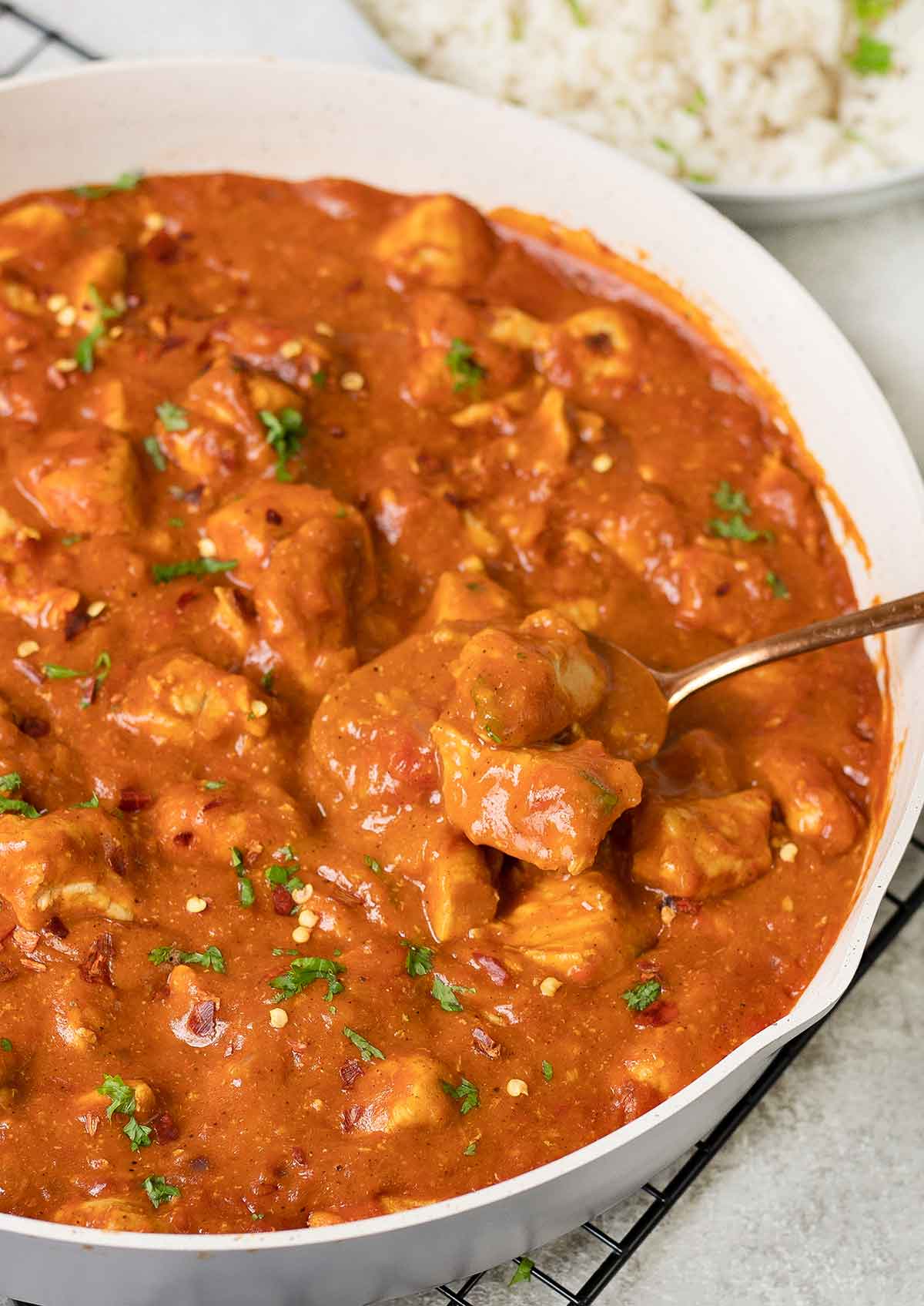 A spoonful of Indian chicken curry.