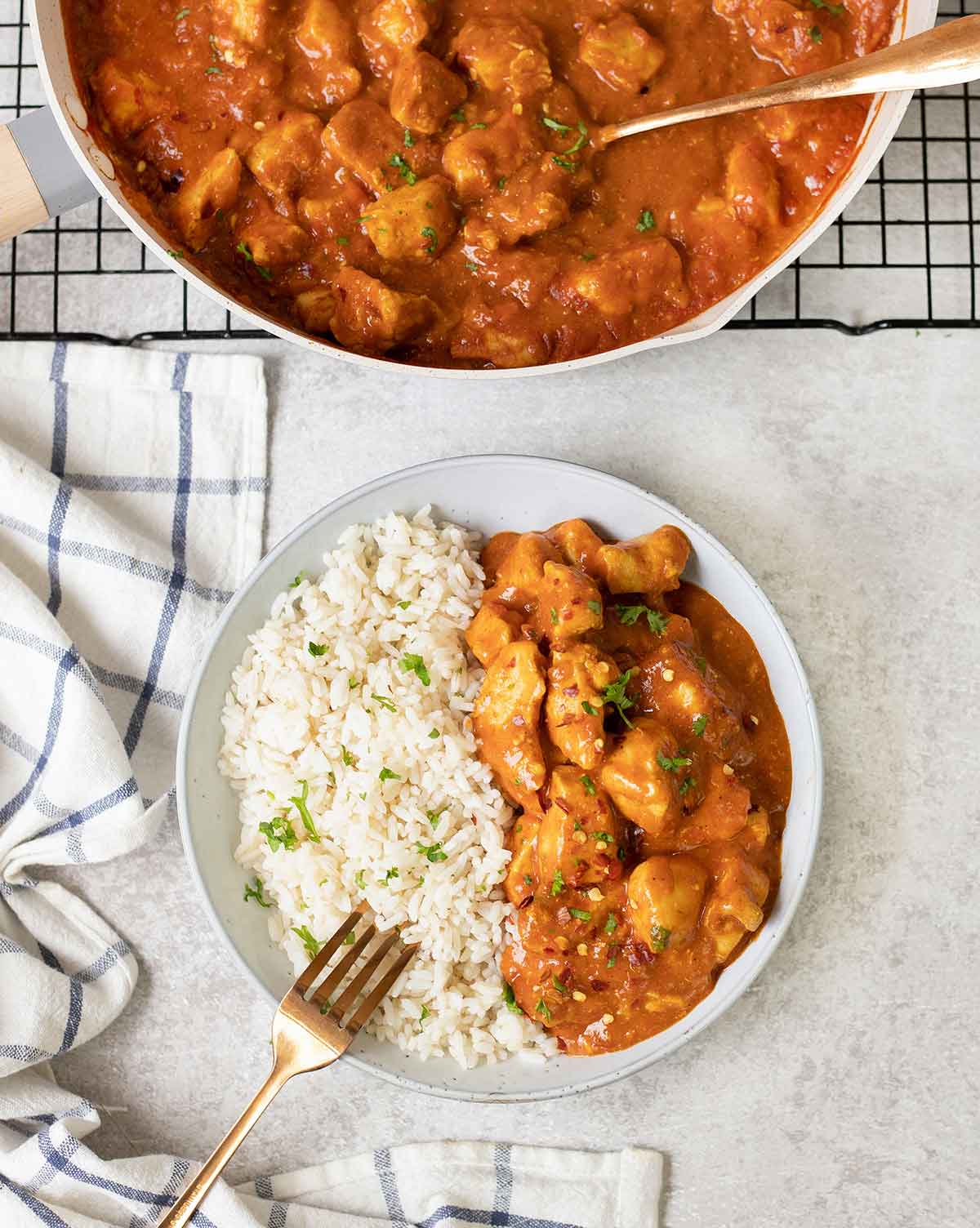 Indian chicken curry on top of white rice.