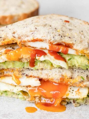 Avocado Egg Sandwich cut into halves.