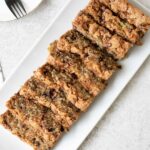 Chocolate Chip Zucchini Bread sliced in a serving plate.