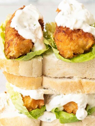 Fish Finger Sandwich with lettuce and sour cream sauce.