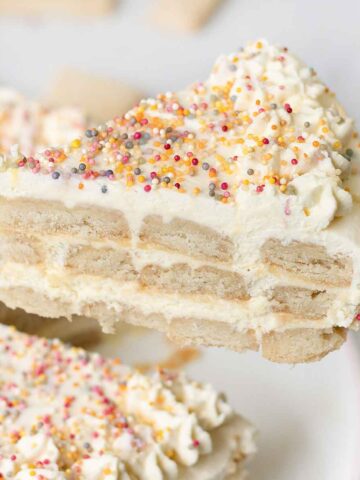 Funfetti icebox cake topped with rainbow sprinkles.