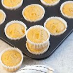 Mango Muffins in a muffin tin.