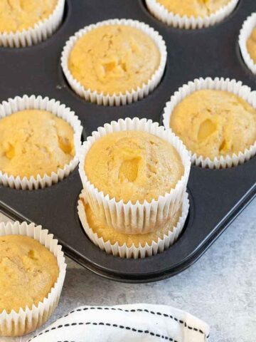 Mango Muffins in a muffin tin.