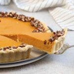 Cut a slice of the Pumpkin Custard Pie.