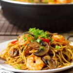 Shrimp And Mushroom Pasta in a serving plate.