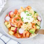 Italian shrimp pasta salad topped with creamy dressing.