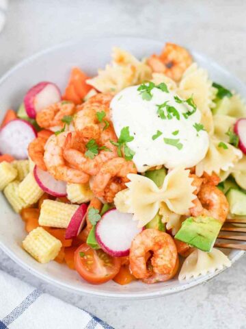 Italian shrimp pasta salad topped with creamy dressing.