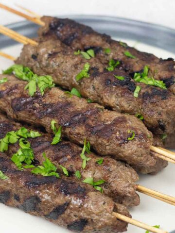 Lamb Seekh Kebab in wooden skewers.