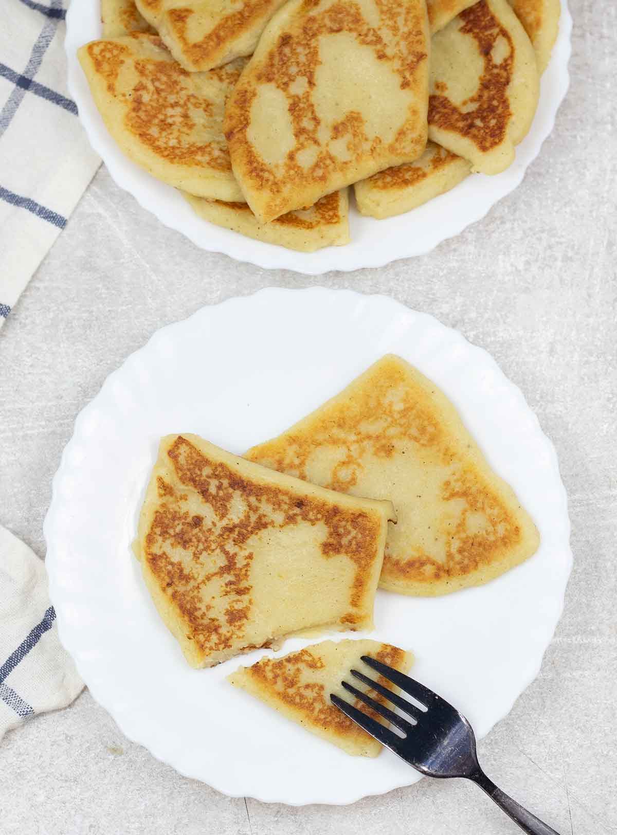 potato scones cut with fork.