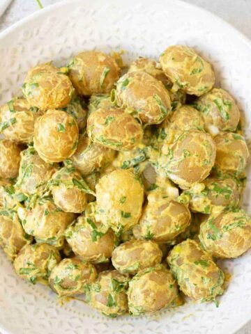 spicy potato salad with Spinach and creamy dressing.