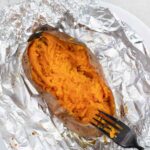 Baked Sweet Potatoes in a foil sheet.