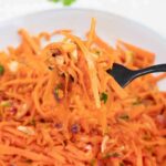 a forkful of Korean Carrot Salad.