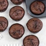 chocolate courgette muffins on a table.