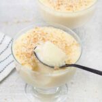 coconut milk pudding topped with toasted shredded coconut.