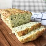 keto zucchini bread cut on a chopping board.