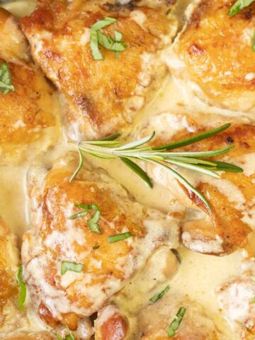 Chicken thighs in a creamy sauce.