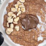 Nutella porridge topped with hazelnut.