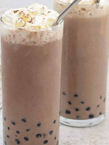 Chocolate Bubble Tea topped with whipped cream.