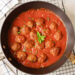 Moroccan meatballs simmered in tomato sauce and topped with fresh mint leaves.