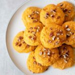 sweet potato cookies topped with chopped pecans.